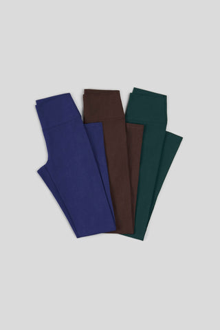 Three pairs of leggings folded in overlapping pattern
