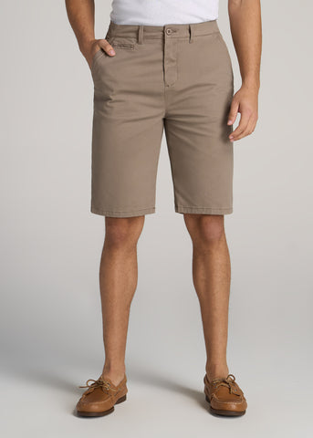 Close-up of man wearing chino shorts with one hand in pocket