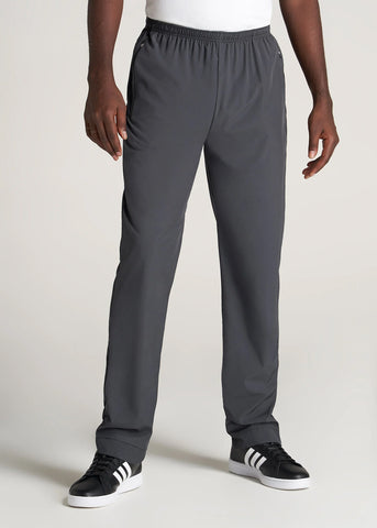 Closeup of man standing wearing relaxed fit athletic pants
